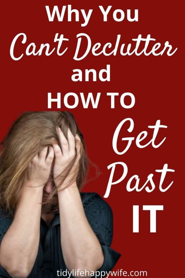 woman agonizing with her face in her hands because of the decluttering roadblocks she keeps encountering