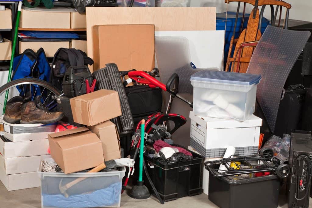 Garage cluttered with boxes and miscellaneous items