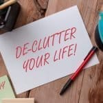 Declutter your life handwritten on a piece of notepad