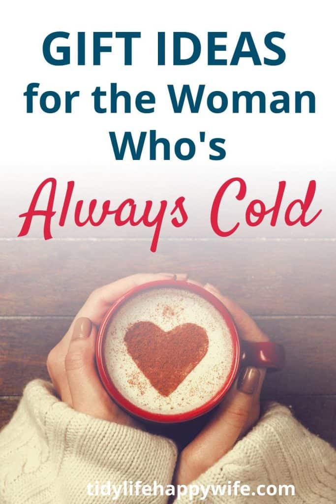 Cold woman holding coffee mug of of hot chocolate