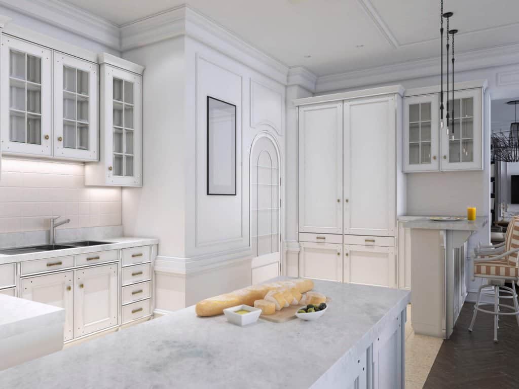 decluttered white kitchen with marble counters