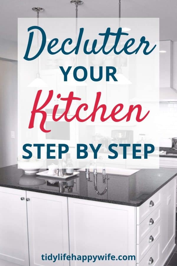 clean and organized white kitchen with black granite countertops