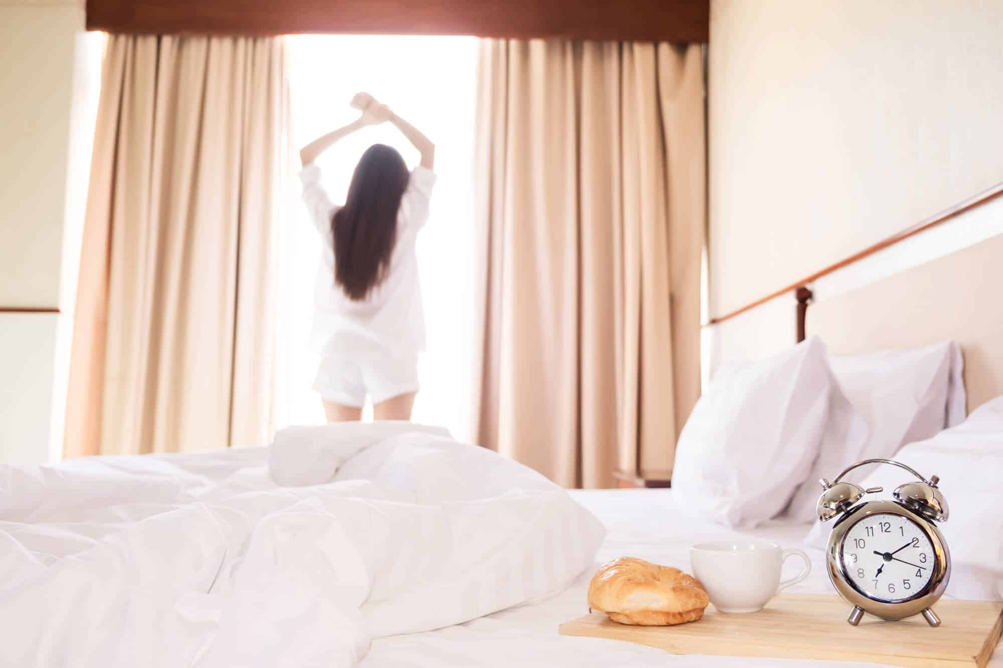 Woman stretching as par of her morning routine