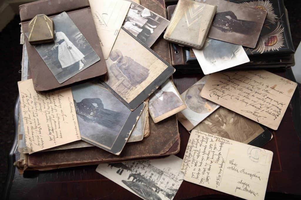 Collection of pictures, postcards, letters, and notes that contribute to sentimental clutter
