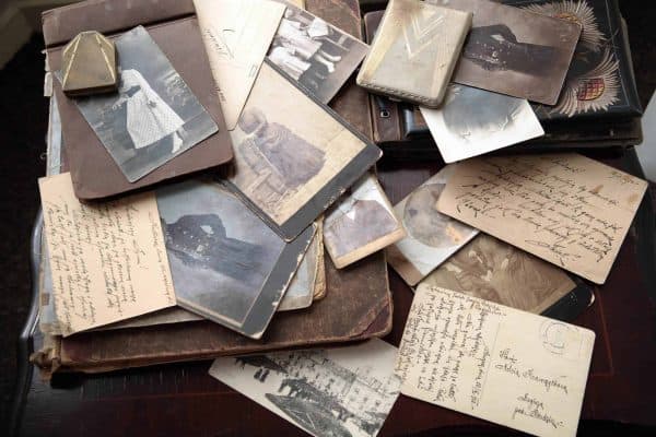 Collection of pictures, postcards, letters, and notes that contribute to sentimental clutter