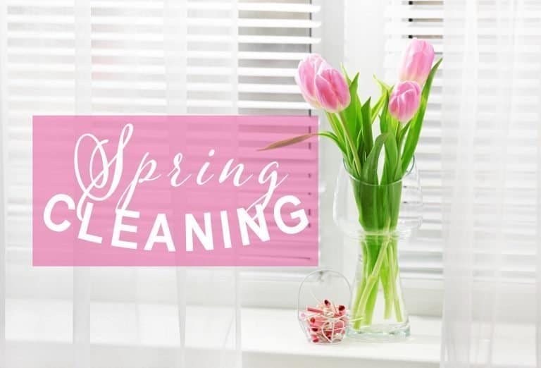 Spring Cleaning sign and a vase of tulips signal that it's time to pull out that Spring Cleaning Checklist