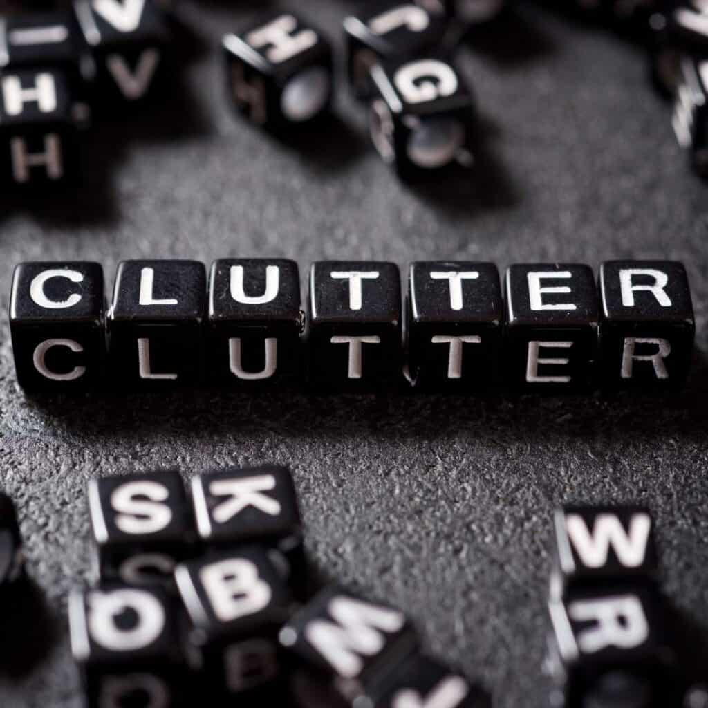 black dice that spell the word clutter