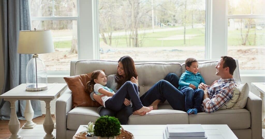 family relaxing on couch together