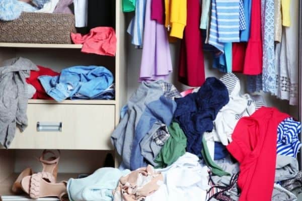 messy closet before being cleaned out