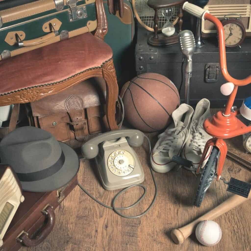 vintage sentimental items including a basket ball, baseball, bat, and tricycle